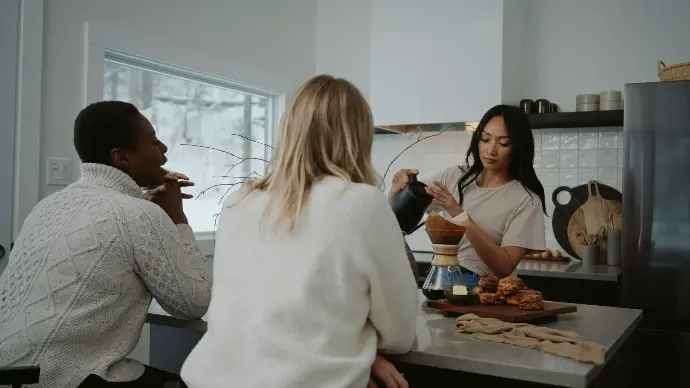 three women make coffee in a kitchen at anyupaya in ottawa valley