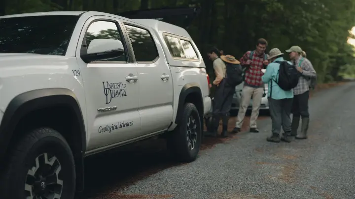 University of Delaware truck and a team of researchers in Delaware, still taken from Mainspring Agency produced film, Salted Earth