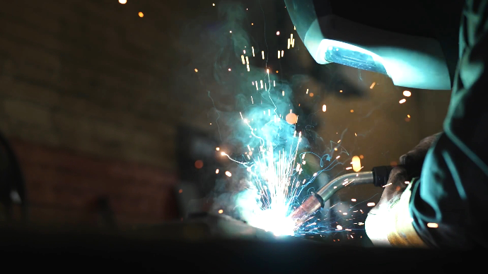 a welder at central wire, Perth Ontario, welds something, a production still from a Perth town video
