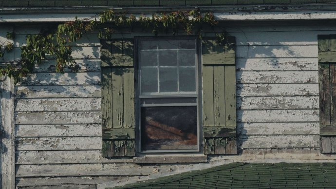 an abandoned house in Maryland's blackwater area, abandoned due to rising water levels, production still from mainspring agency's documentary, salted earth